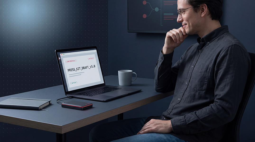 PR strategist preparing a press kit at a minimalist workspace